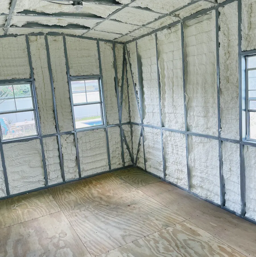 Closed-cell spray foam insulation applied to wall cavities in a residential project in Lynbrook
